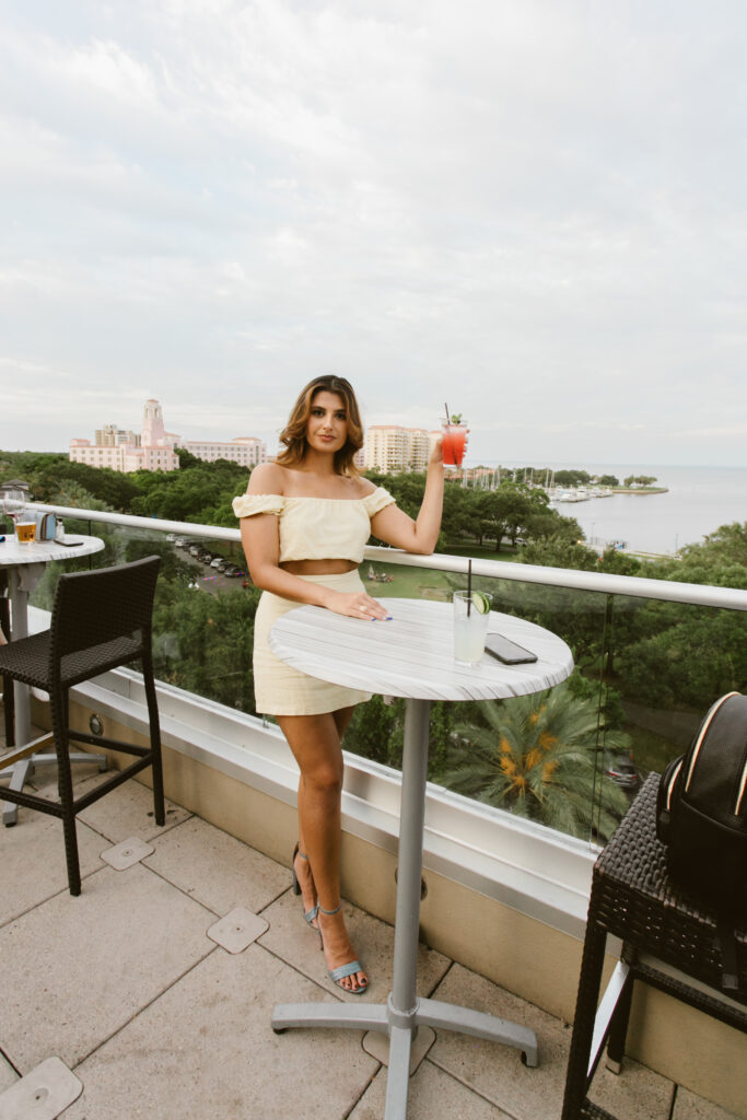 gabrielle troyer for rooftop collective enjoys a cocktail at the canopy, a rooftop bar in st pete florida