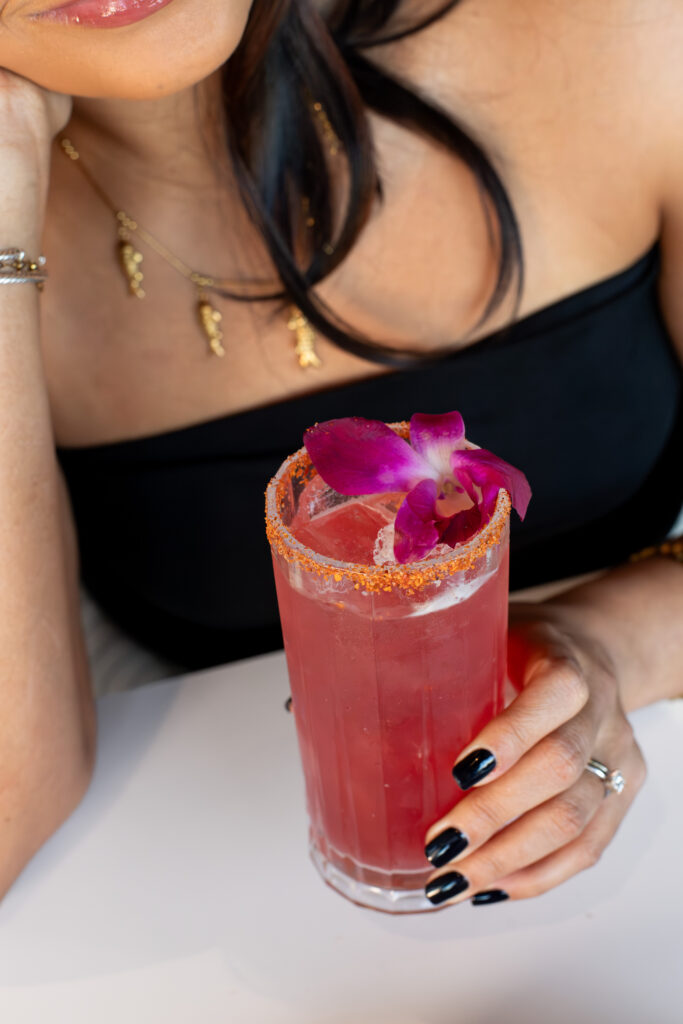 LUMA restaurant in St Pete offers the Santa Sol: cristalino tequila, Ancho Reyes, lime, hibiscus syrup, and a Tajín rim. 